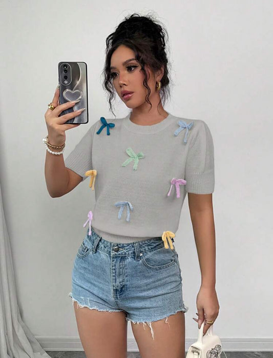 Blusa de punto con moños arcoíris Talla Mediana