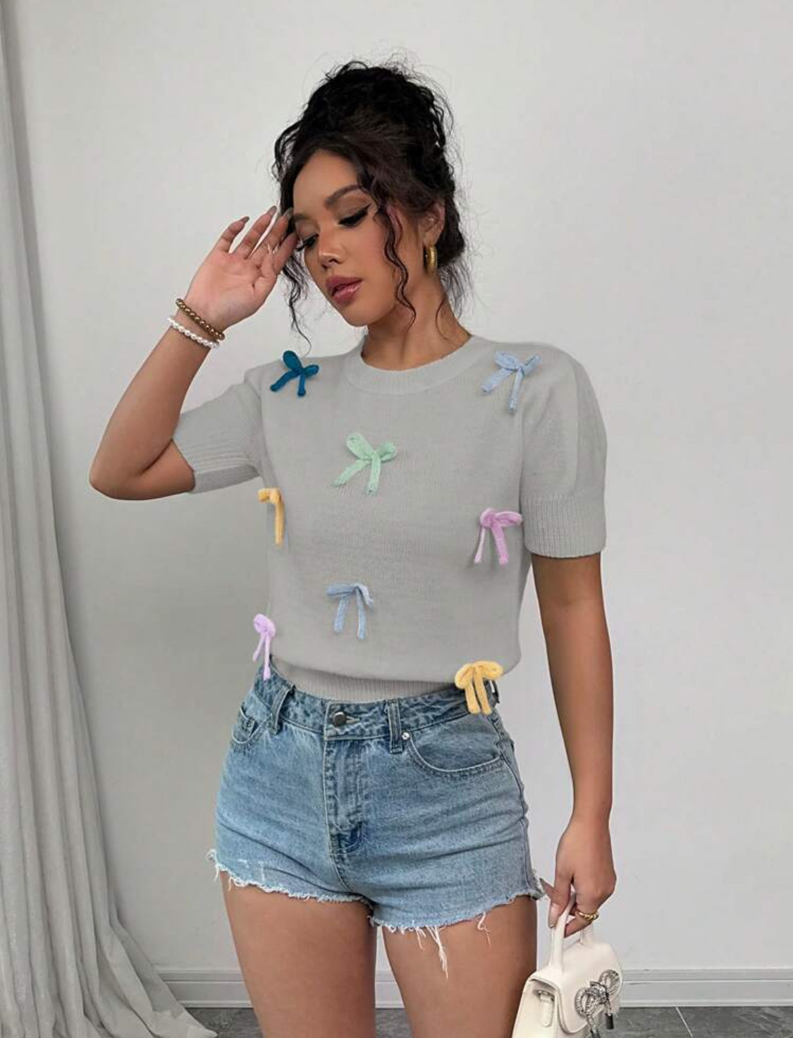 Blusa de punto con moños arcoíris Talla Mediana