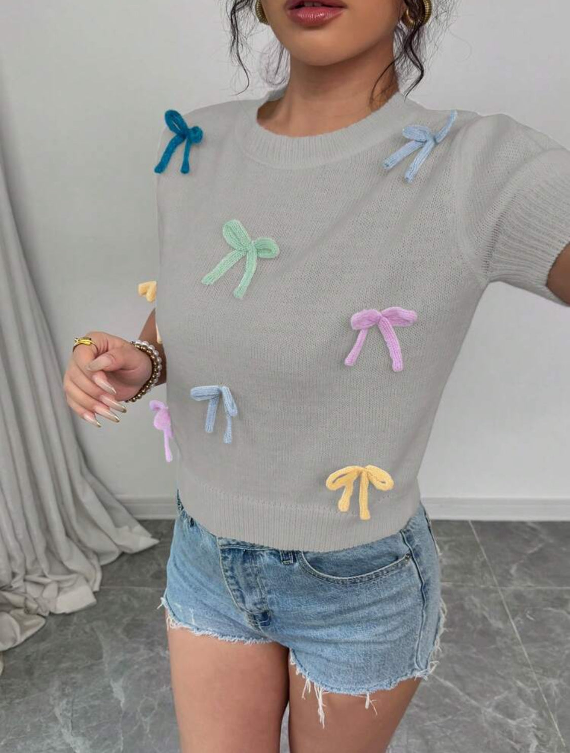 Blusa de punto con moños arcoíris Talla Mediana