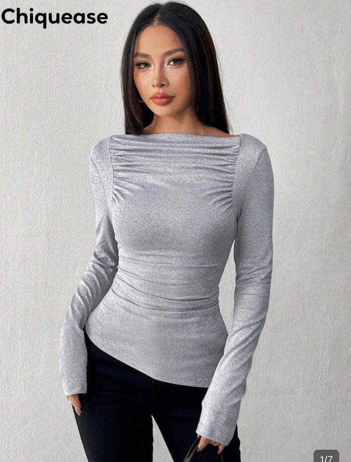 Blusa gris ajustada y elástica de  manga larga talla
