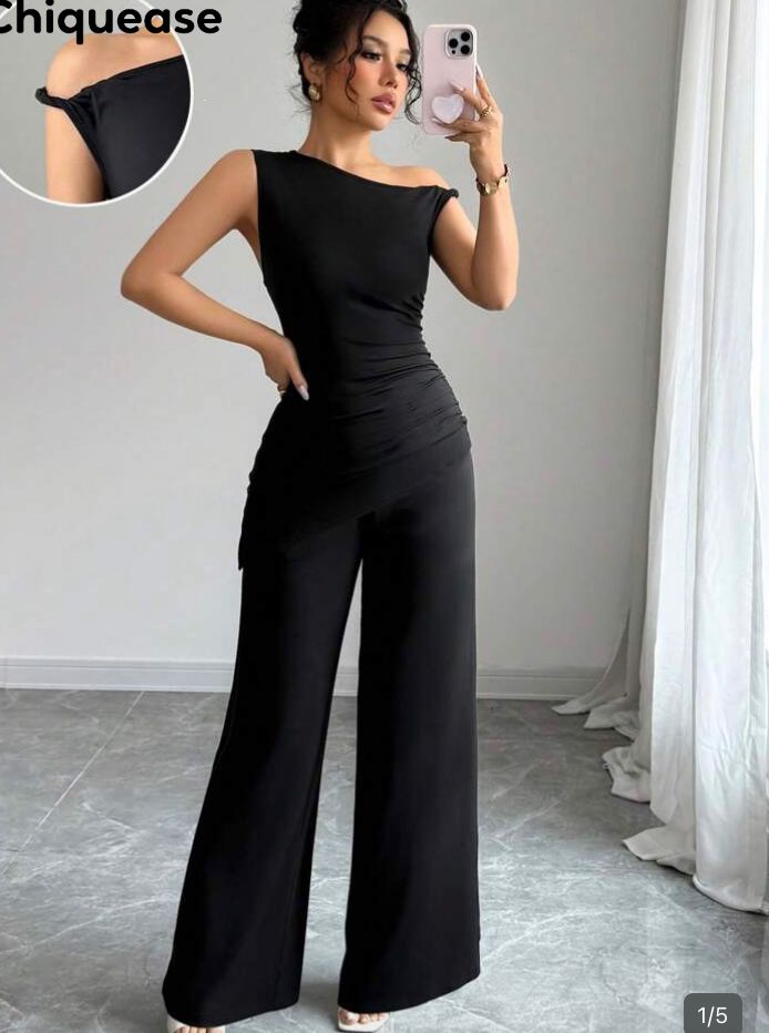 Conjunto negro dos piezas de top asimetrico de un hombro talla