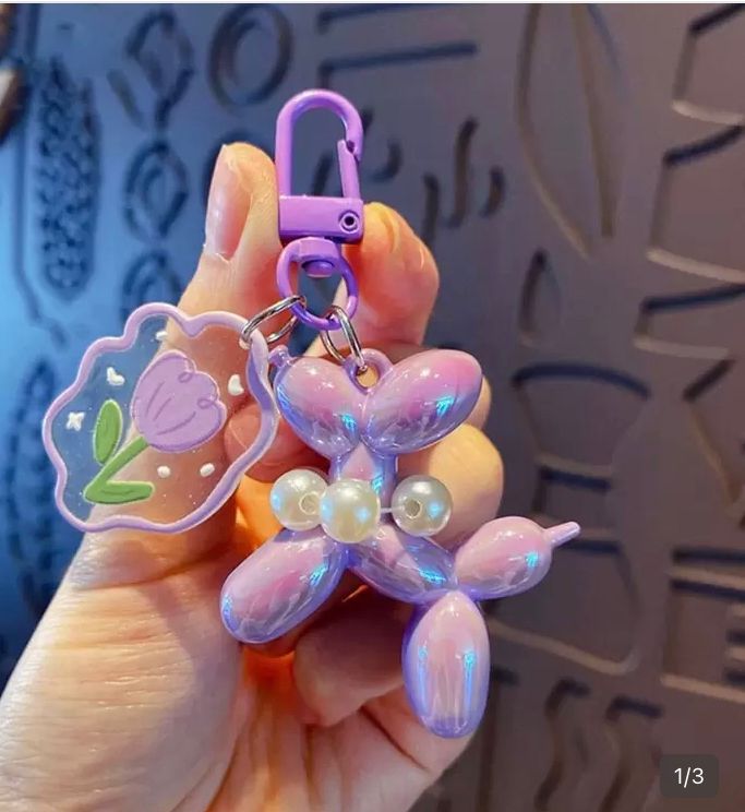Llavero con diseño de burbuja y cachorro, morado